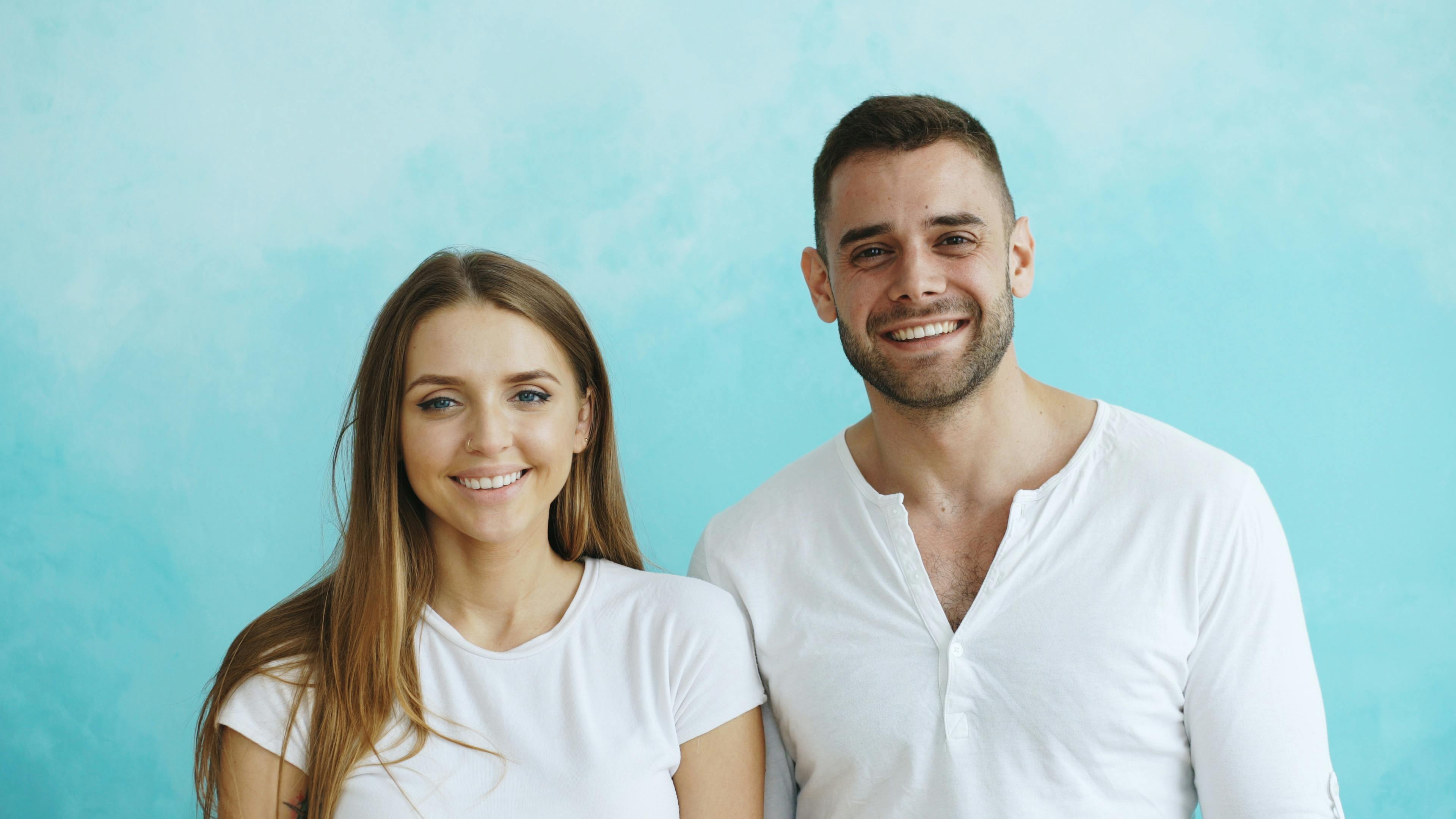 Two people smiling together